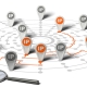 Many flags withe the word IP pined on network over white background and a magnifier. Concept image for illustration of IP tracking.